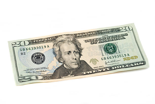 Twenty dollar bill, United States Currency, on white. Studio shot.
